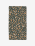 The Loretta bath towel by Charlie Rowan Designs features a rectangular shape and a beige and white floral pattern on dark green, crafted with Geoweave technology for ultra-absorbency.