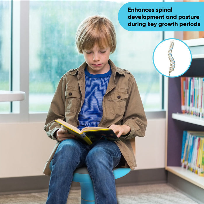Child reading on ergonomic wobble chair for kids in library, promotes posture and core strength