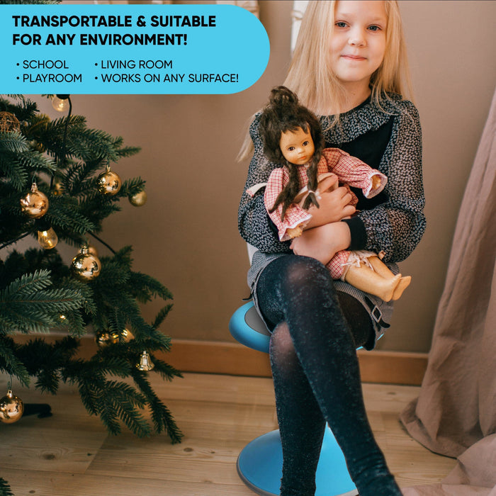 Child sitting on blue ergonomic wobble chair for kids near Christmas tree holding doll, Office Logix Shop product