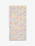 The Lots of Dots Bar Towel by Rebecca Bobko is a rectangular white towel with yellow, pink, red, purple, and teal polka dots in a colorful pattern, made from durable Geoweave fabric.