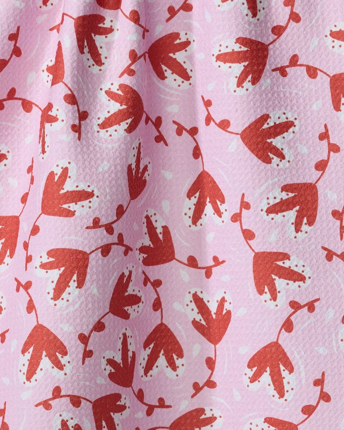 Love Blooms by Charlie Rowan Designs features pink textured fabric with whimsical red and dark pink abstract floral shapes—ideal for an ultra-absorbent or recycled kitchen towel.