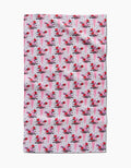 The Love Bouquet recycled kitchen towel by Charlie Rowan Designs features a pattern of pink and red ice cream cones with cherries on a white background with black dots.