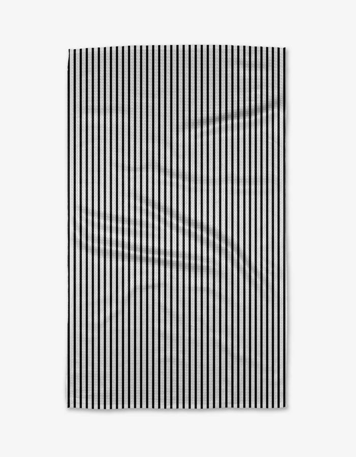 The Love Notes tea towel by Kailee Wright is a rectangular white towel with evenly spaced vertical black stripes. Made from Geoweave fabric, it features slight visible creases that add a subtle textured touch to its minimal design.