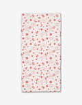 The “Love Party” bar towel from Charlie Rowan Designs is ultra-absorbent, white, and features a playful pattern of red hearts, dots, and scattered “LOVE” lettering.