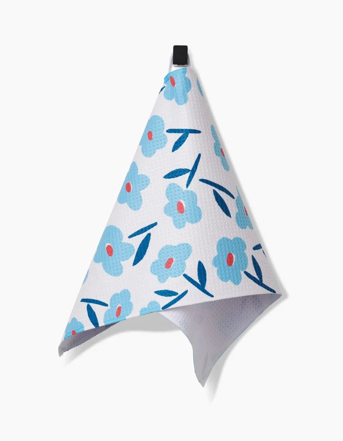 The Luca Daisy Bar Towel by Hufton Studio features blue flowers with pink centers and blue leaves on white Geoweave fabric, shown against a white background.