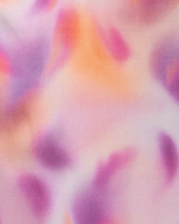 The GEOMETRY Magenta yoga towel features a soft, abstract background with blended pastel pinks, purples, and oranges, creating a dreamy tranquility perfect for inspiring calm during your next session.
