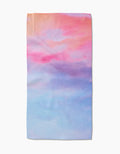 The Magic In The Sky Bar Towel by Stefanie Bales features a dreamy pastel gradient of pink, peach, lavender, and blue on Geoweave™ fabric, shown flat against a white background.