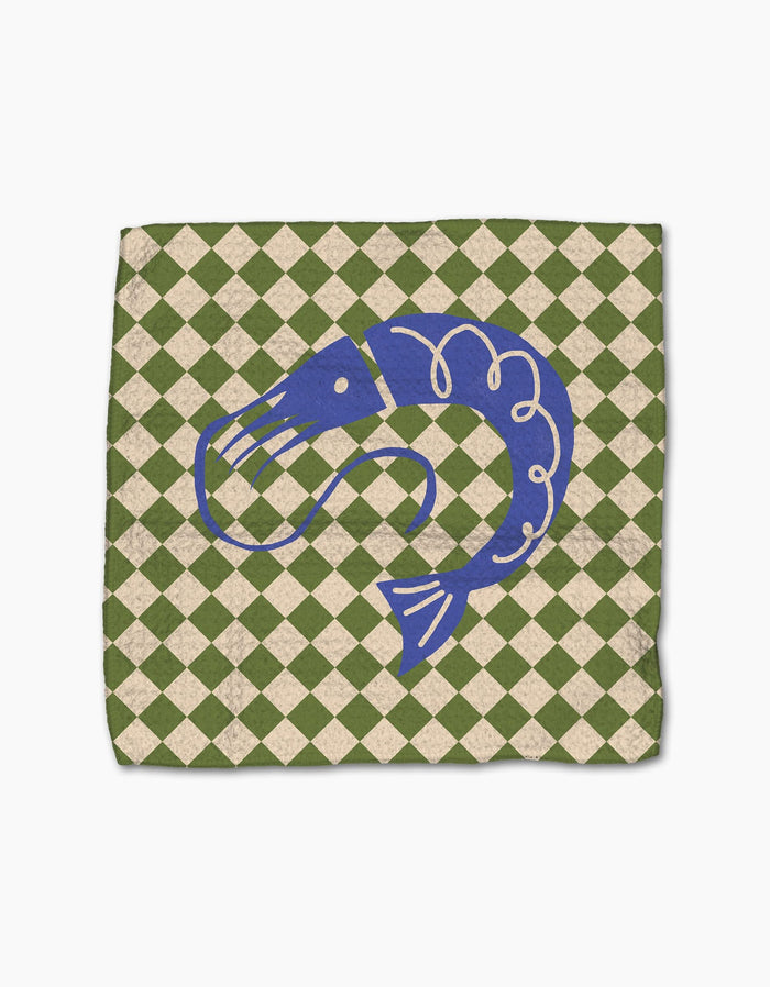 The Mar by Geometry features a blue shrimp illustration centered on a green and beige checkered background, evoking the look of a decorative recycled dishcloth or napkin.