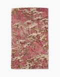 The Maximist Floral tea towel by Geometry features an abstract floral design with white flowers and green stems on a textured pink background, and is crafted from recycled materials.