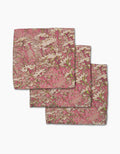 Three folded Geometry Maximist Floral handkerchiefs, made from super-absorbent Geoweave fabric with a white flower and green stem pattern, are stacked in a staggered arrangement on a white background.