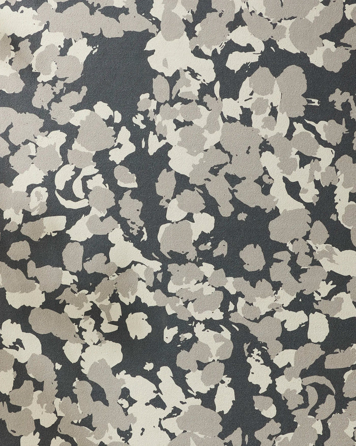 A close-up of Metro Mesh by GEOMETRY, showcasing an abstract camouflage pattern with irregular beige, gray, and black blotches on a non-slip yoga towel—perfect for adding textured style to your practice.