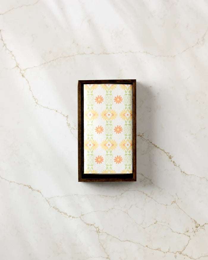 The Mindfulnice "Mindful Mix" soap, featuring a pastel peach and mint green floral-geometric design, rests in a dark wooden tray on light marble with brown veining, accompanied by eco-friendly paper towels.