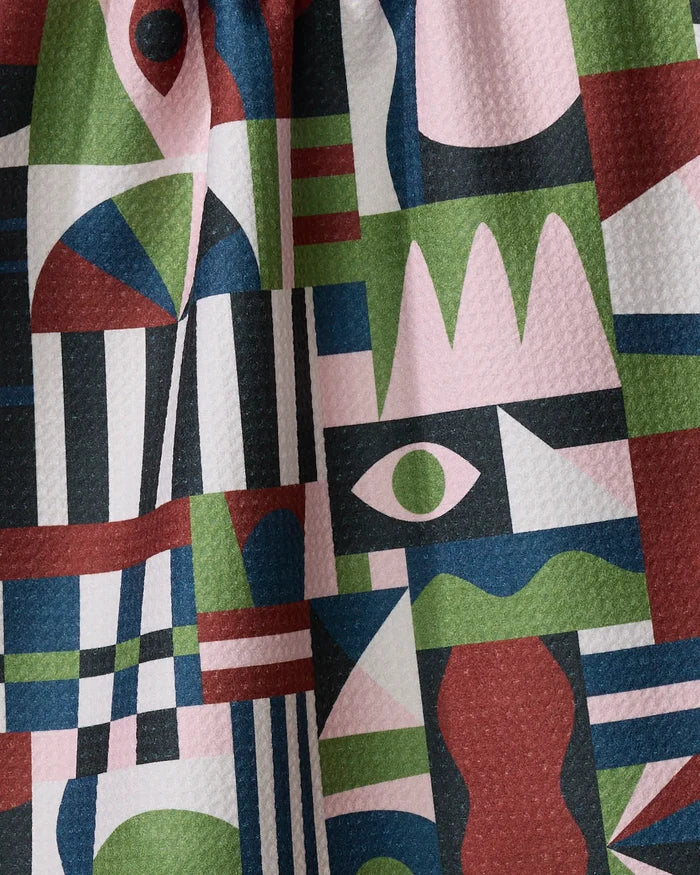 Modern Bauhaus Mood by Claire Iglesias features an abstract geometric pattern with eyes, zigzags, triangles, and rectangles in green, pink, black, white, and red—ideal for an ultra absorbent or recycled kitchen towel.