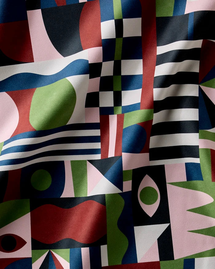 Modern Bauhaus Mood by Claire Iglesias: bold, colorful abstract fabric with geometric and organic forms in red, green, blue, black, and white—ideal for a contemporary Dinner Napkin Set of absorbent cloth napkins with a softly wrinkled texture.