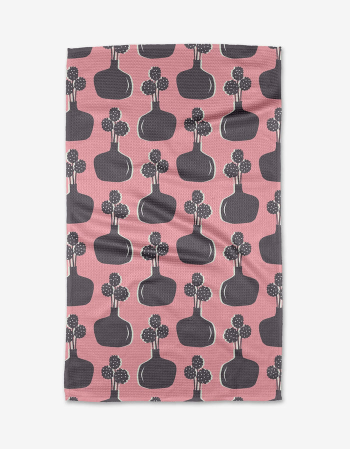 Modern Bouquet by Lizzie Clark is a pink cloth with dark gray vases and stylized dotted flowers, crafted from ultra-absorbent Geoweave fabric for a playful, modern touch.