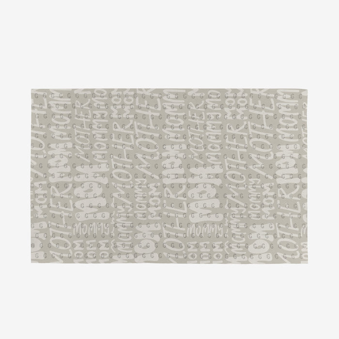 The GEOMETRY Mom mat features a repeating handwritten mommy pattern in light gray on white, made from eco-friendly materials—a stylish, planet-friendly choice.