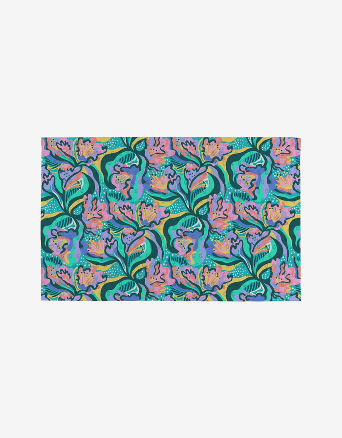 Moody Flowers by Masha Volnova features a vibrant floral pattern with pink and purple abstract flowers, green leaves, and blue accents on a light background—ideal for eco-friendly reusable towels made from recycled materials.