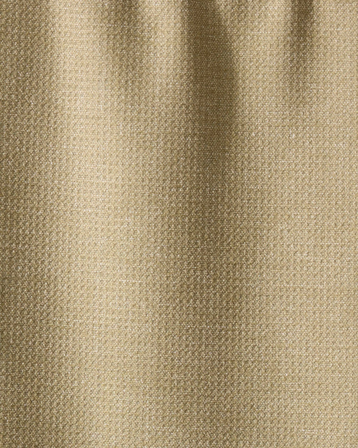 Close-up of Geometrys Mosswood towel in textured beige fabric, featuring a subtle weave pattern and soft vertical folds. The ultra-absorbent surface has a slight sheen, reflecting light gently.