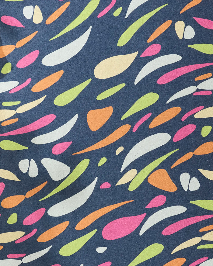 The GEOMETRY Motion recycled yoga towel features a playful abstract pattern of pink, orange, green, and off-white shapes on dark blue—perfect for adding dynamic style to your non-slip yoga towel collection.