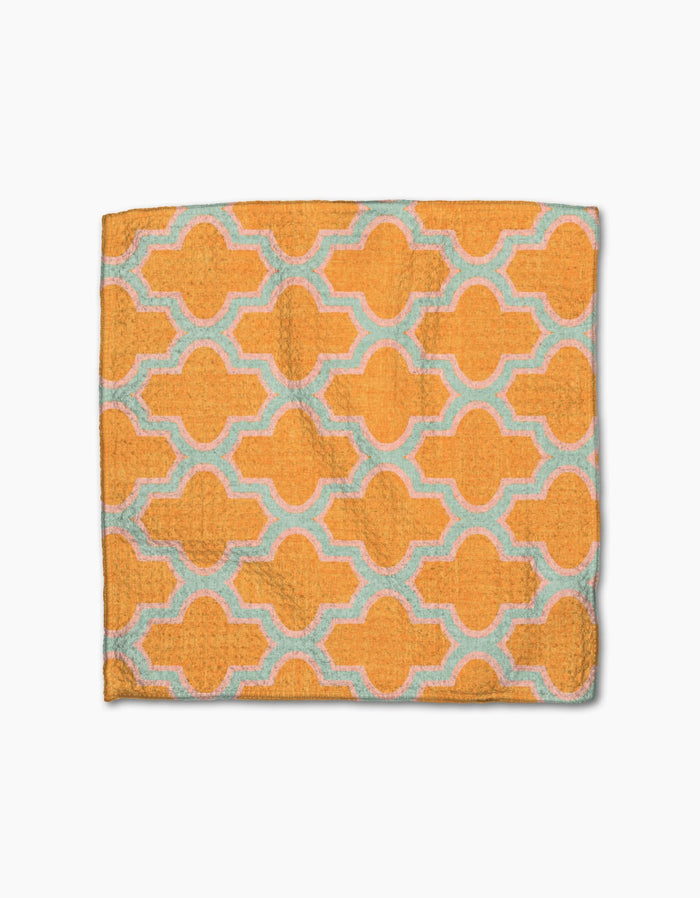 The Mustard Ogee towel by Pascale Dilger is a rectangular textile made from recycled materials with a textured surface and repeating geometric patterns in light blue, shown laid flat on a white background.