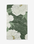 A green and white My Dear Itoh Tea Towel by Ashley Celena, featuring a large floral pattern with outlined white flowers, yellow accents, and ultra-absorbent textured Geoweave fabric.
