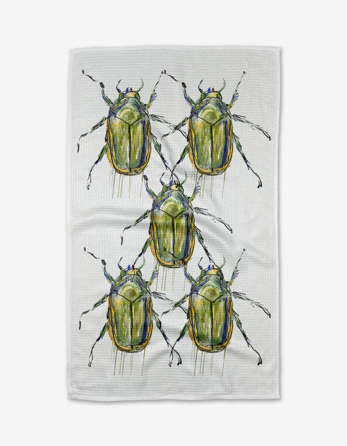 The Olive Beetles tea towel by Taryn Brennan is made from white Geoweave™ fabric and features five large, green beetles with detailed legs and antennae arranged in a loose grid.