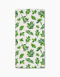 The Olive Grove towel by Geometry features ultra-absorbent white fabric with a stylish repeating green olive branch pattern—perfect as a chic bar towel for your kitchen.