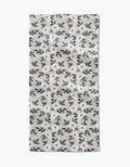 The Painted Spring Flowers Bar Towel by Teri the Butter features a white, rectangular design with small white flowers, yellow centers, and blue-green leaves on a light grey background. Made from durable Geoweave fabric.