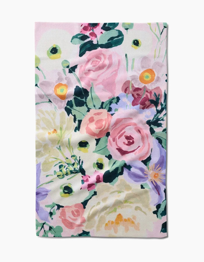 The Pastel Bouquet cloth by Ania Zwara Art features a colorful floral pattern—pink roses, white and yellow flowers, green leaves, and purple accents on a light Geoweave fabric for superior absorbency.