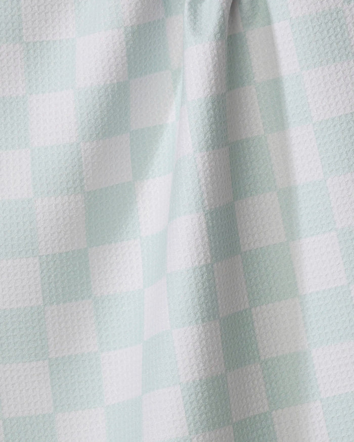 Close-up of the Pastel Picnic kitchen towel by Sweet Simple Vegan, showcasing its light blue and white checkered recycled fabric with a subtle textured pattern and gentle folds.
