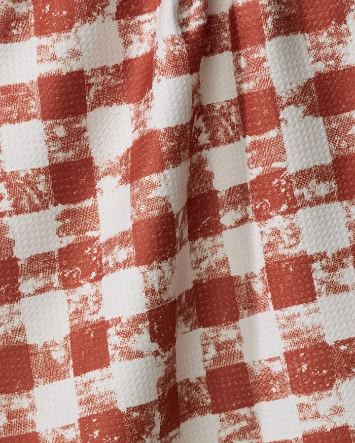 The Geometry Patch Spice tea towel features a red and white checkered design with a textured, vintage-inspired finish. Its slightly wrinkled look and uneven, faded checks add charm to your kitchen essentials.