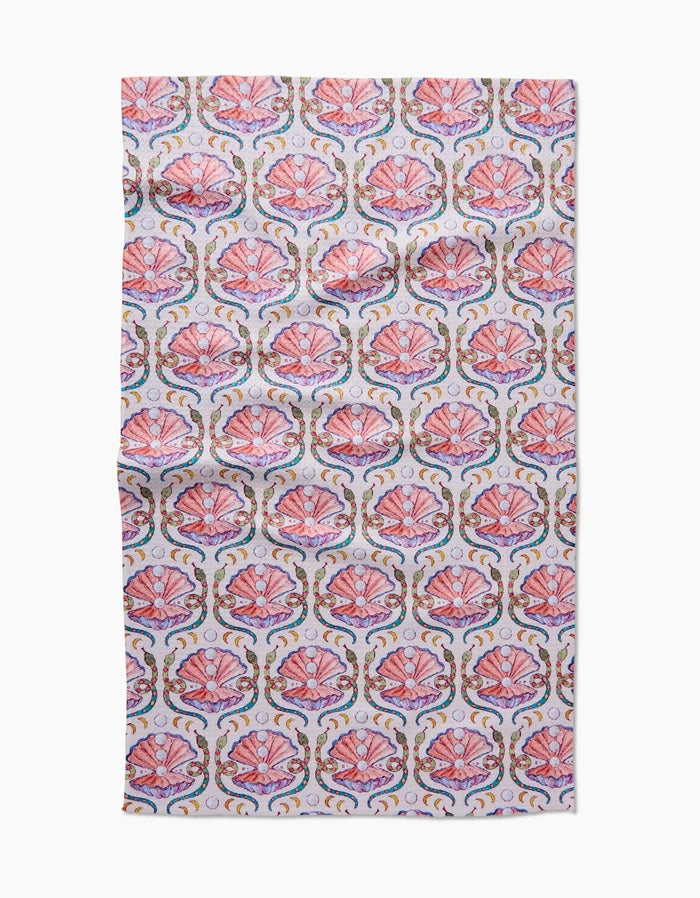 Pearls Of The Moon by Maayan Alper-Swan features a repeating pink seashell pattern with gold and blue accents on white Geoweave fabric. Ultra-absorbent with gentle wrinkles, perfect as a towel or fabric.