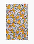 The Pears Petals tea towel by Maayan Alper-Swan features bright yellow pears and white flowers with pink centers on a greenish Geoweave fabric made from recycled materials, and has a slightly wrinkled texture.