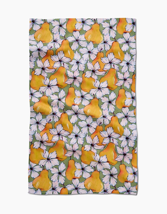 The Pears Petals tea towel by Maayan Alper-Swan features bright yellow pears and white flowers with pink centers on a greenish Geoweave fabric made from recycled materials, and has a slightly wrinkled texture.