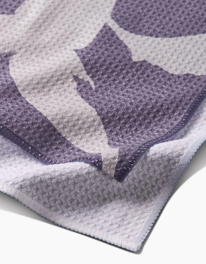Close-up of the Pepper bar towel by PrintedPlant, featuring a textured purple and white waffle pattern, crafted from Geoweave fabric with neatly stitched edges and a soft, layered look.