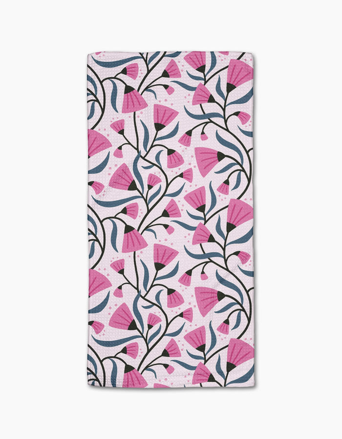 The Petal Symphony Bar Towel by Anette Heiberg features a repeating pink flower pattern with dark green stems on white, crafted from Geoweave fabric for superior absorbency.