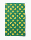 The GEOMETRY Pickleball tea towel is green, rectangular, made of Geoweave fabric, and features a pattern of evenly spaced yellow pickleballs.