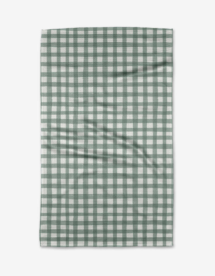 The Picnic Gingham tea towel by Hufton Studio, made from Geoweave™ fabric, features a green and white checkered pattern and is shown flat on a white surface with slight creases.