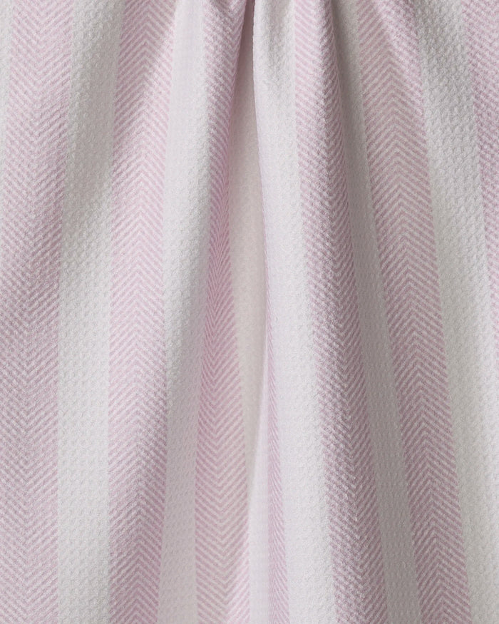 Close-up of the Teri the Butter Pink Chevron Stripe kitchen tea towel, showcasing pale pink and white vertical stripes with a subtle herringbone texture and soft folds.
