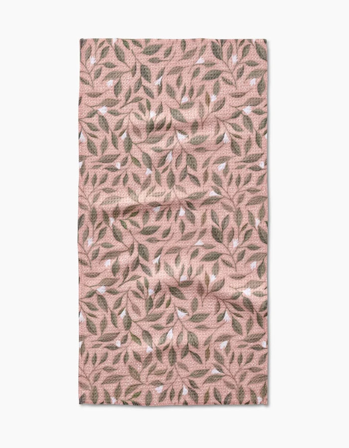 The Pink Mint Leaves bar towel by Katie OShea features a pink rectangular design with a quilted texture and an all-over pattern of green, brown, and white leaves on Geoweave fabric for a natural, organic look.