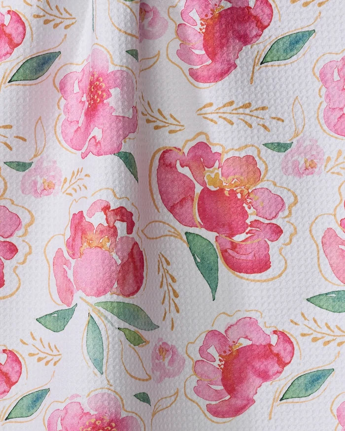 The Elena Fay Pink Peony towel features a watercolor-style floral pattern with large pink peonies, green leaves, and yellow accents on ultra-absorbent textured white fabric.