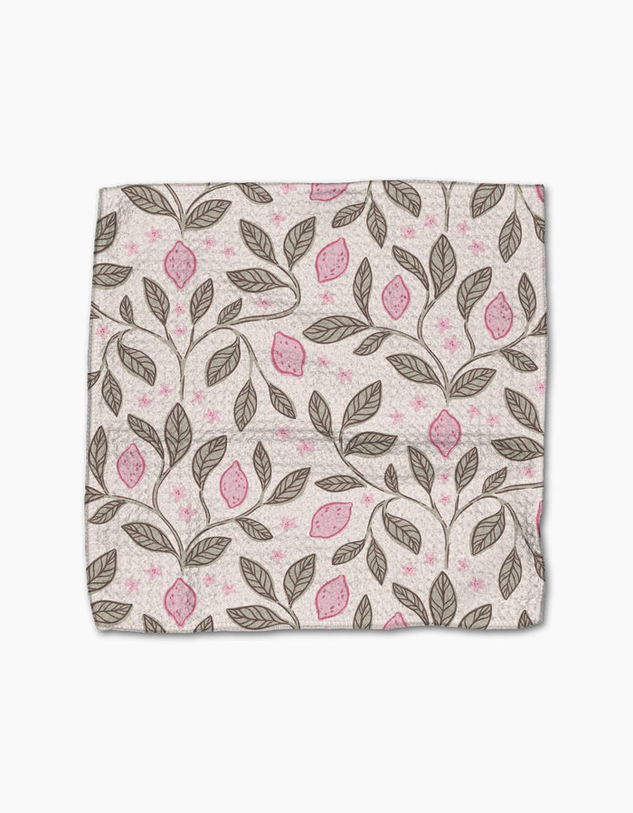 Pink Summer by Teri the Butter is a rectangular cloth made from recycled materials, featuring brown branches with leaves and pink fruits on a light background. The fabric has a slightly wrinkled look and is shown on a white surface.