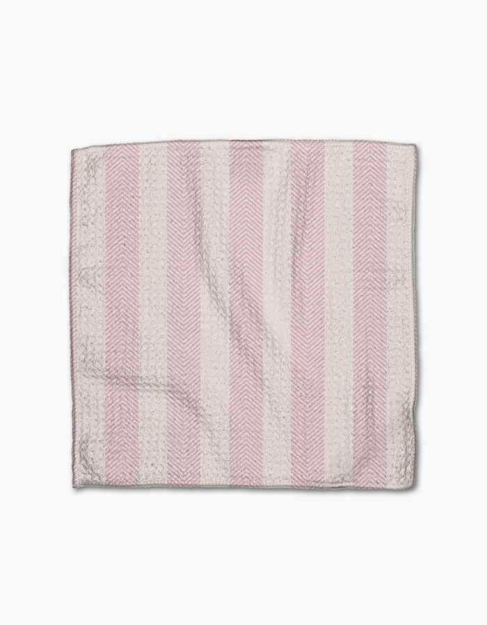 The Pink Summer dishtowel by Teri the Butter features alternating vertical pink and white stripes with a subtle herringbone texture, displayed flat on a white background.