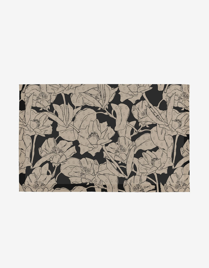 A seamless, dense botanical pattern of beige hand-drawn flowers and leaves on black showcases eco-friendly style—perfect for Aubrey Fairchild’s Plant One on Me Not Paper Towels made from post-consumer recycled materials.