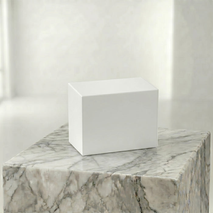 White insert box on a marble surface with a neutral background