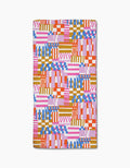 The Playful Stripes rug by Claire Iglesias features an abstract geometric pattern in pink, orange, blue, red, and white on a plain background. Made from recycled materials, it showcases stripes, checks, and blocks.