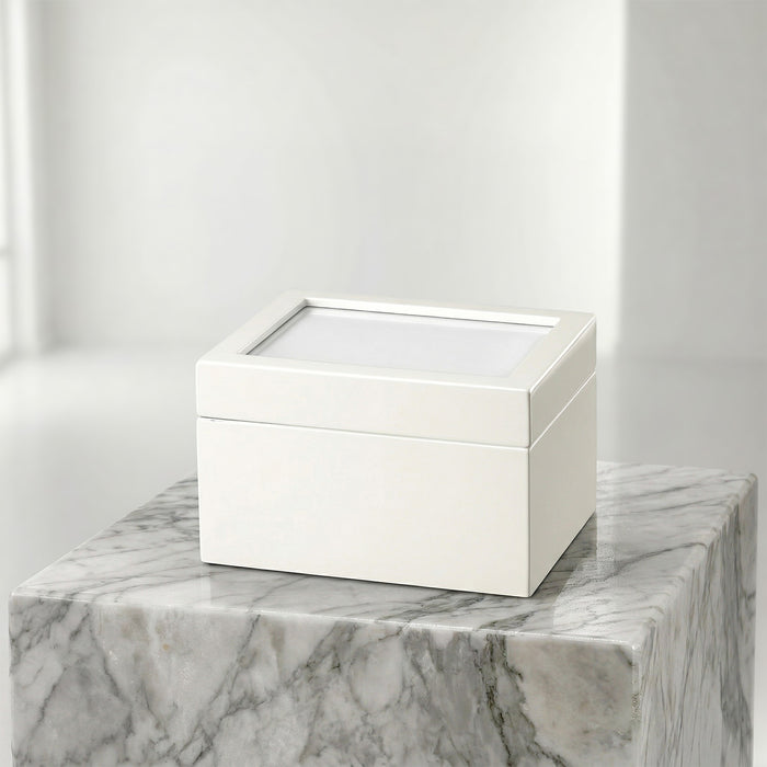 White portrait urn chest on a marble surface with a white background