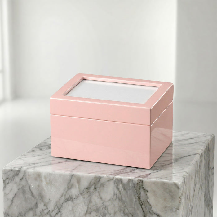 Pink portrait urn chest on a marble surface
