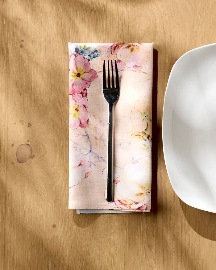 A fork on a Pascale Dilger Primroses Geosuede fabric dinner napkin set.