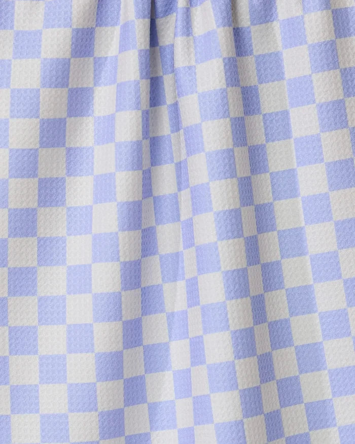 Close-up of Purple Picnic by GEOMETRY, featuring purple and white gingham checkered fabric with a textured surface and gentle folds—perfect for an ultra-absorbent tea towel in any kitchen.